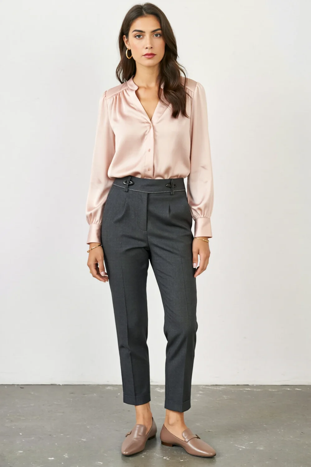 Blush silk blouse with shoulder shirring and charcoal cigarette pants, finished with taupe pointed pumps for polished office style