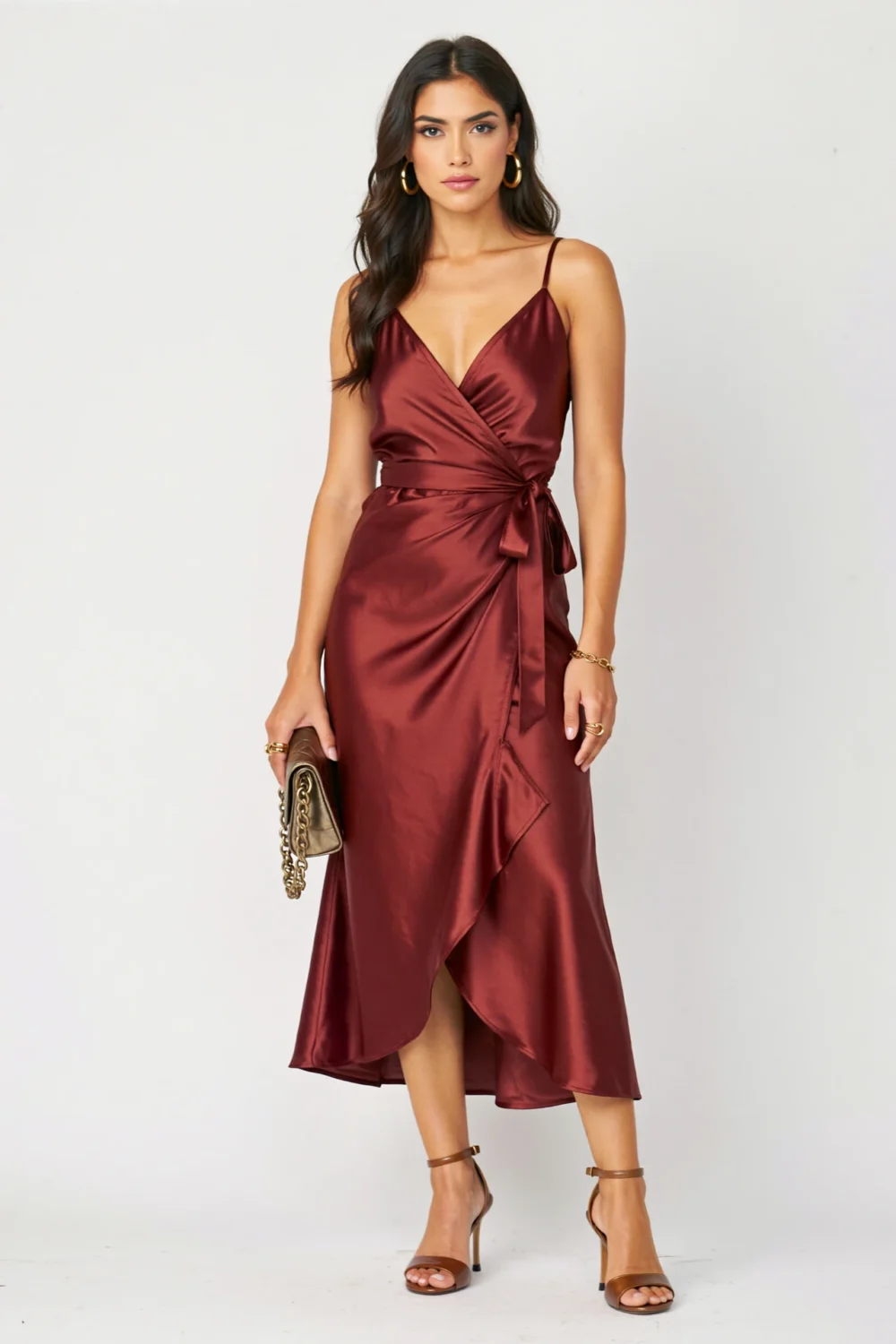 Burgundy satin wrap dress with glossy finish, tulip skirt and tie waist, styled for an elegant fall wedding look