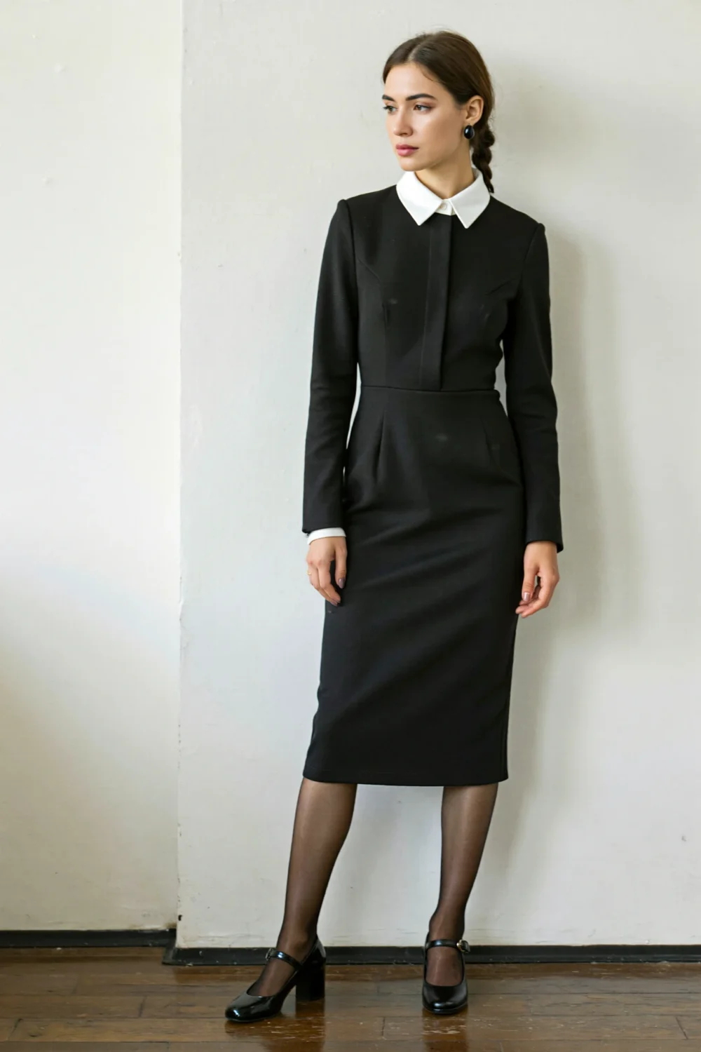 Black crepe corporate dress with white collar, modest hem, opaque tights, and Mary Janes for a polished gothic office look