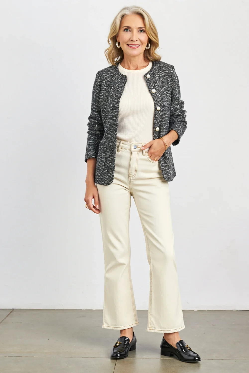 Ecru kick-flare jeans with ribbed tee and pearl-button cardigan-blazer, styled with hoop earrings for a polished, soft-smart look.