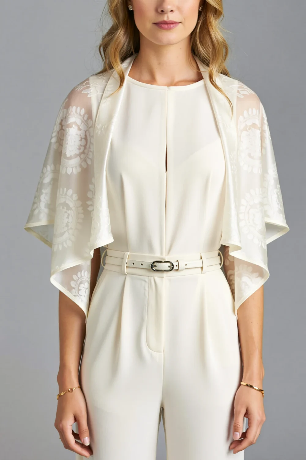 Elegant cream short-sleeve jumpsuit with belt and lightweight chiffon shawl, featuring a defined waist and polished tailored look for ceremonies