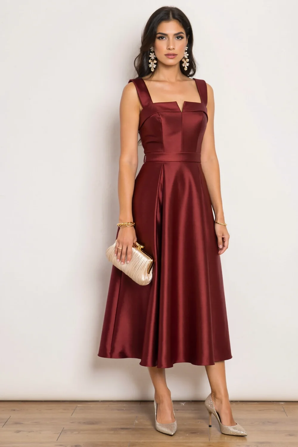 Elegant garnet midi dress with square neckline, structured bodice and pleated skirt, styled with champagne clutch and heels for quinceanera elegance