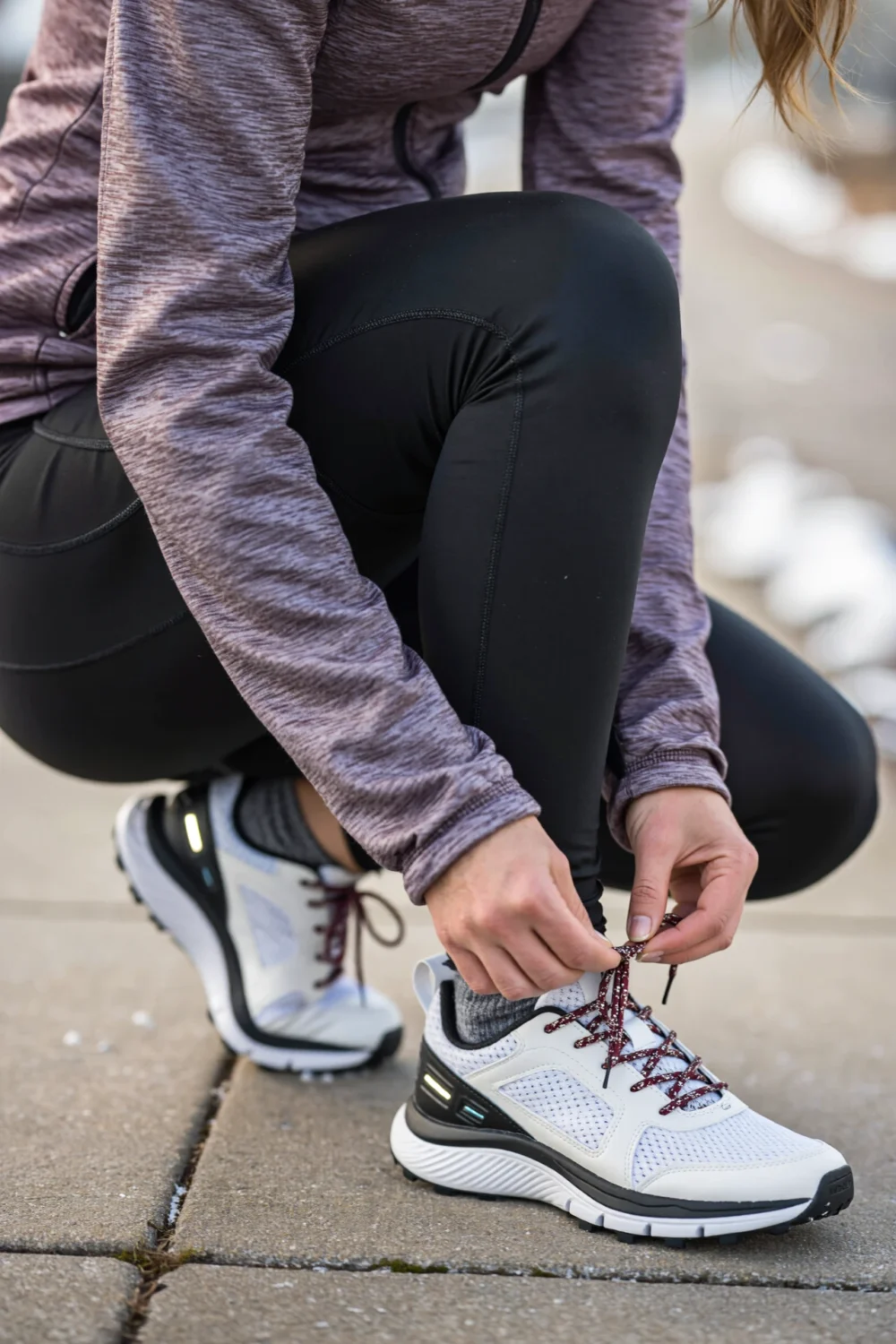 A woman tying shoelaces