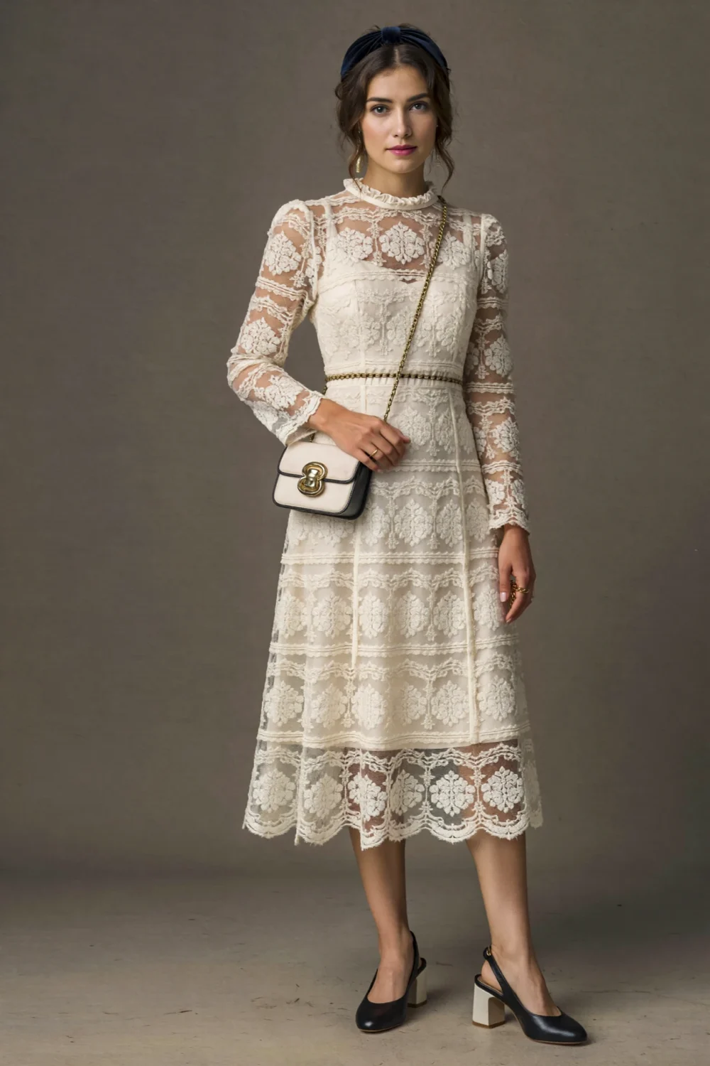 Cream lace midi dress with velvet headband and low block heels, styled with a vintage-inspired crossbody in a polished, romantic look