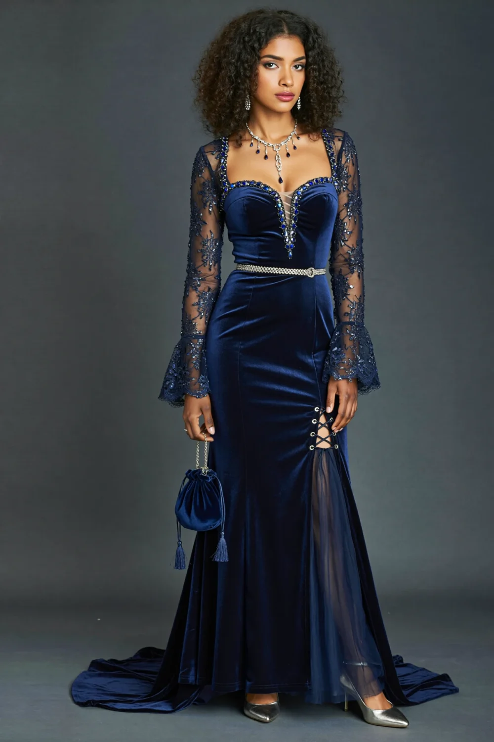 Midnight blue velvet corset gown with crystal beading, sheer bell sleeves, lace-up slit, and sweeping cathedral train for regal elegance