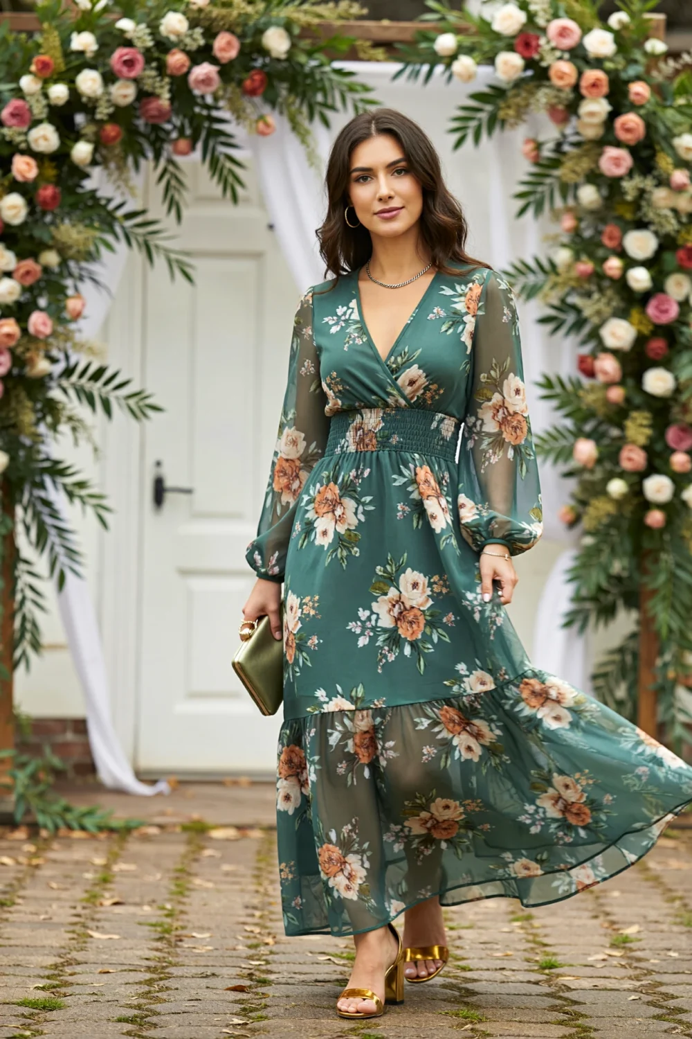 Moss green floral chiffon maxi dress with sheer sleeves, shirred waist and flowing skirt, styled for an outdoor fall celebration