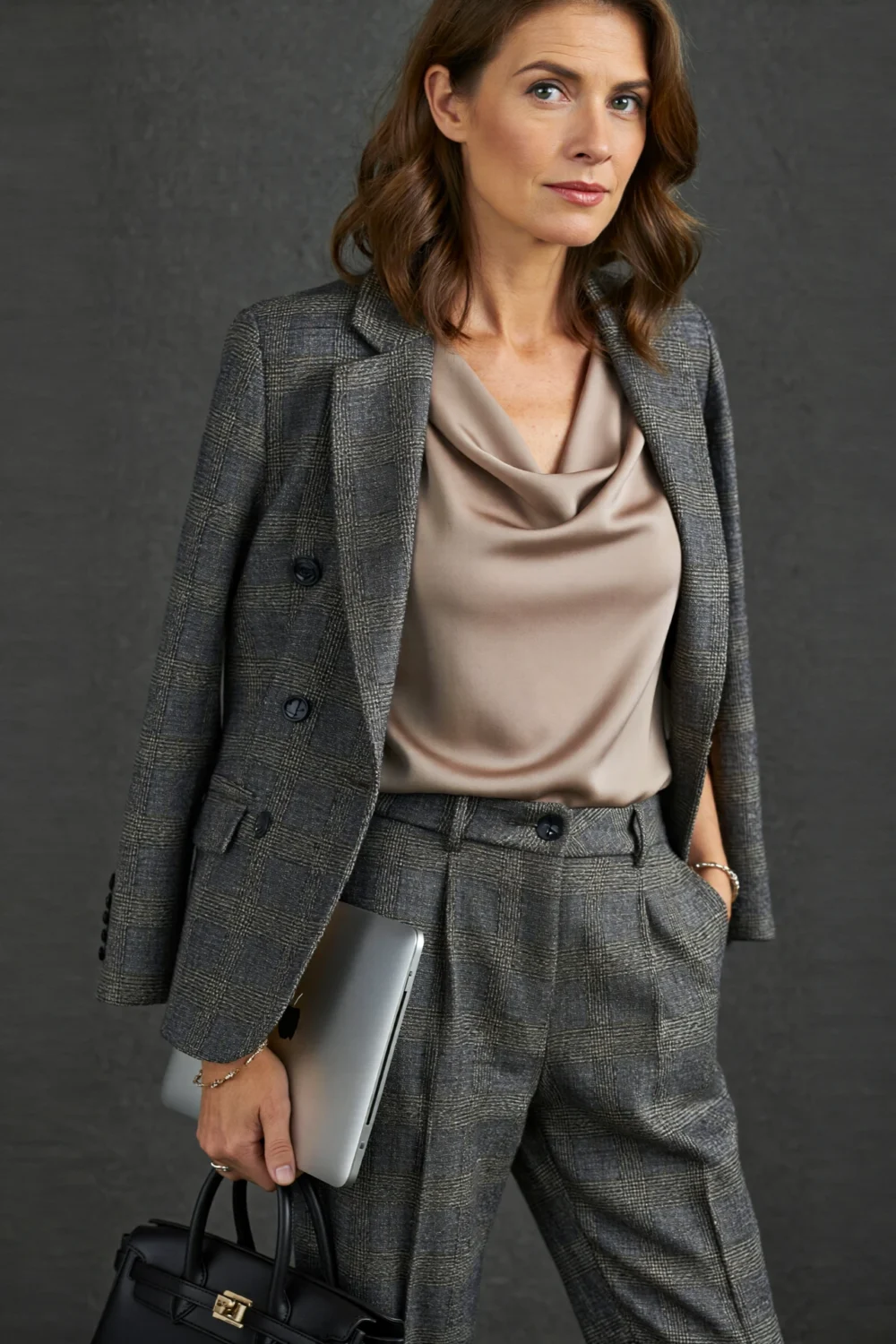 Monochrome taupe column outfit with lightweight blazer, streamlined trousers, and minimal accessories for a refined modern silhouette