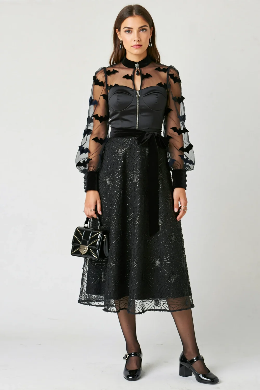 Black fit-and-flare midi dress with bat-print organza sleeves, silver spiderweb shimmer, and elegant Halloween-ready silhouette