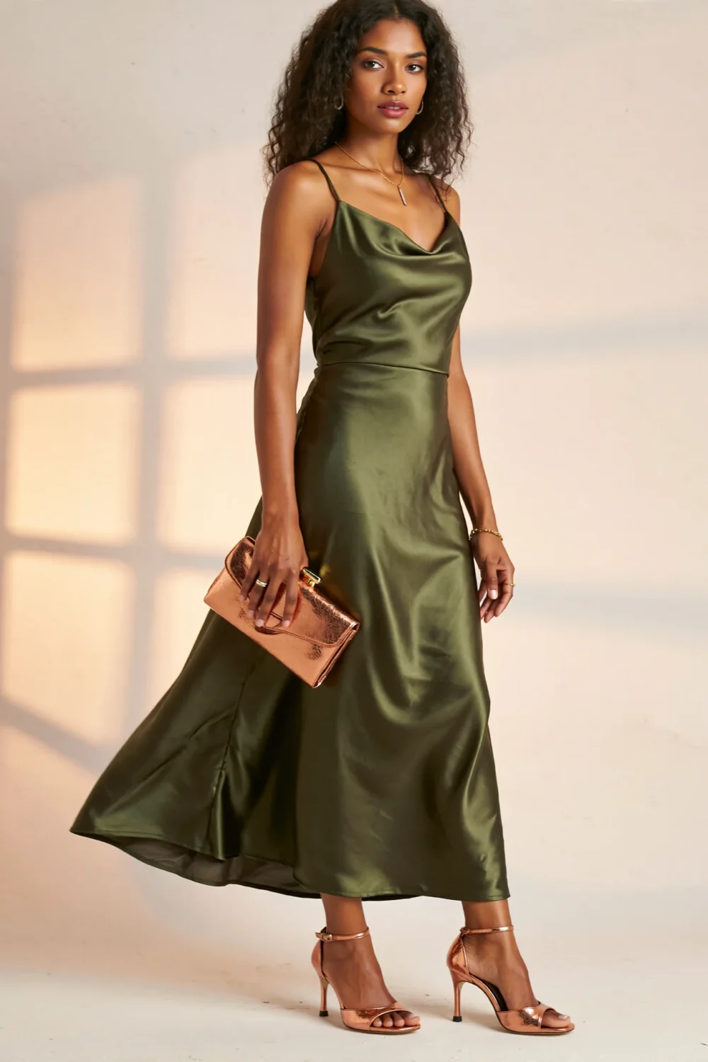 Olive green satin dress styled with soft copper bronze metallic heels and clutch for a warm, elegant, nature-inspired evening look