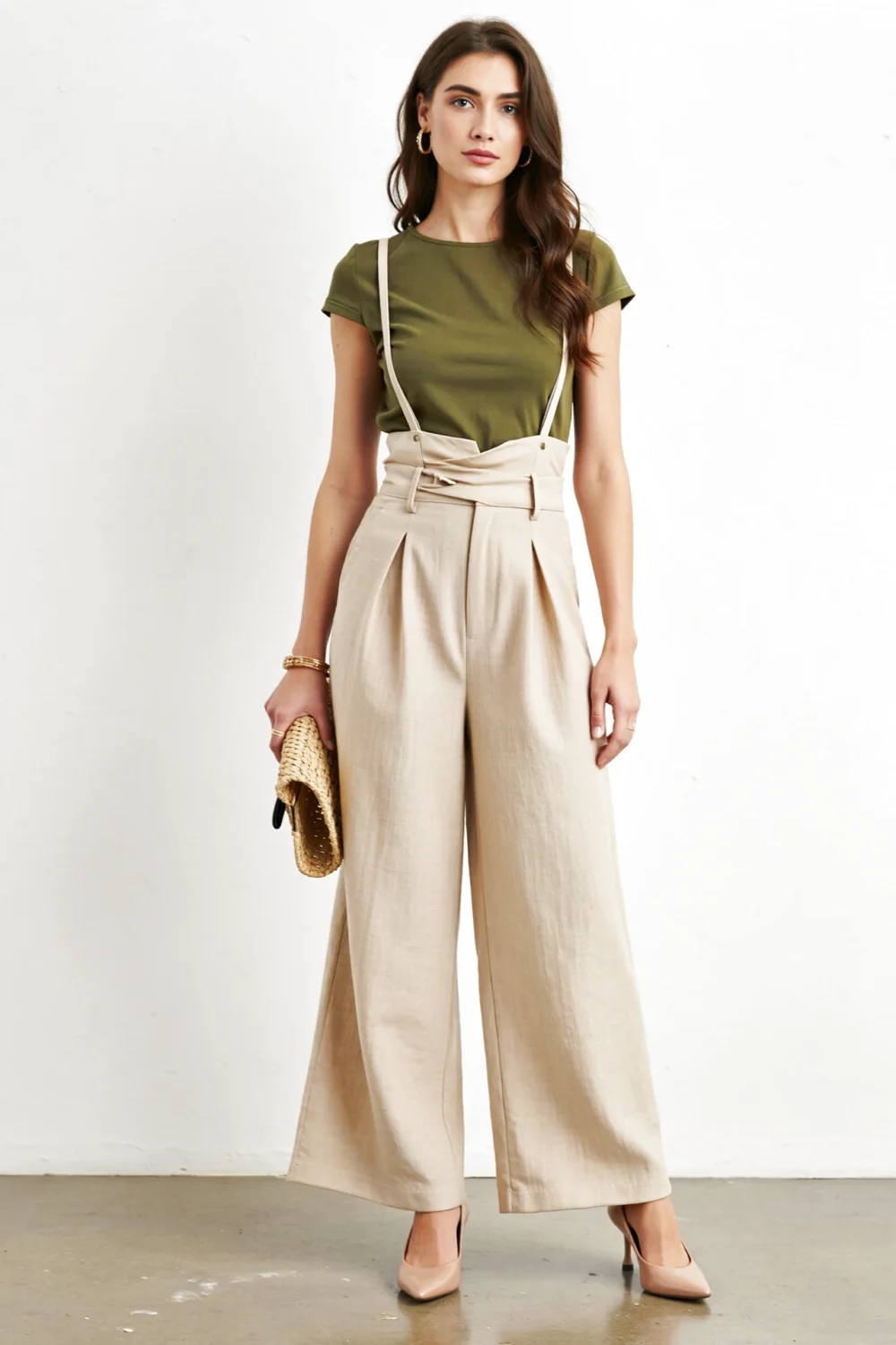 Olive top with beige wide-leg trousers creates an elevated neutral look, styled with nude pumps and a raffia clutch for polish