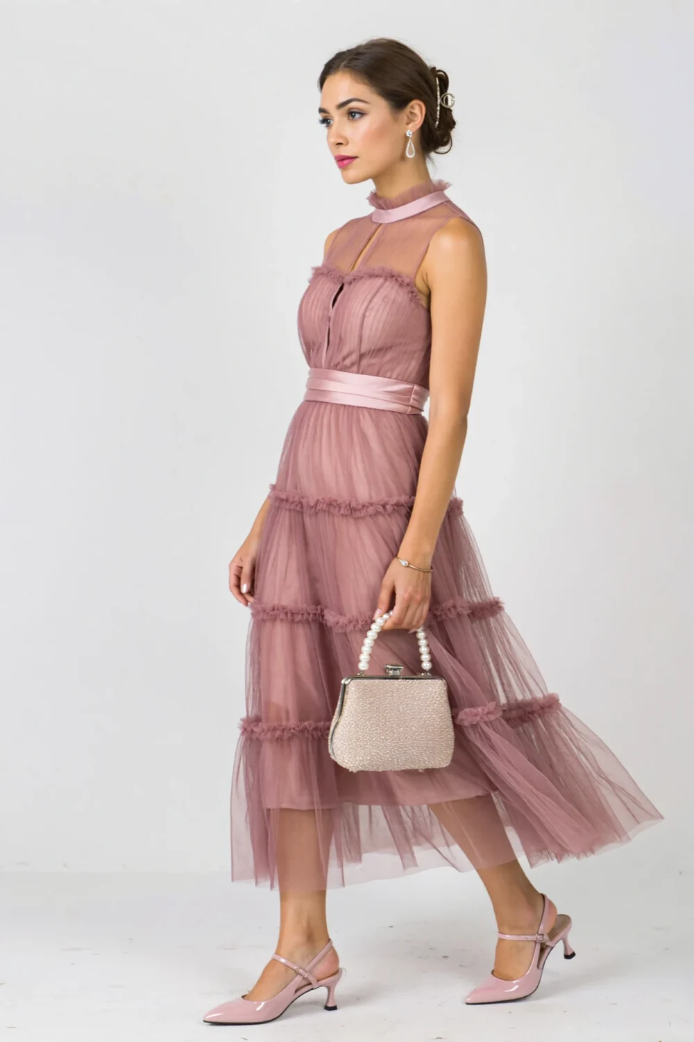 Dusty-rose tea-length midi dress with high neck, satin waist, and tiered tulle ruffles, perfect for a quinceañera dance floor