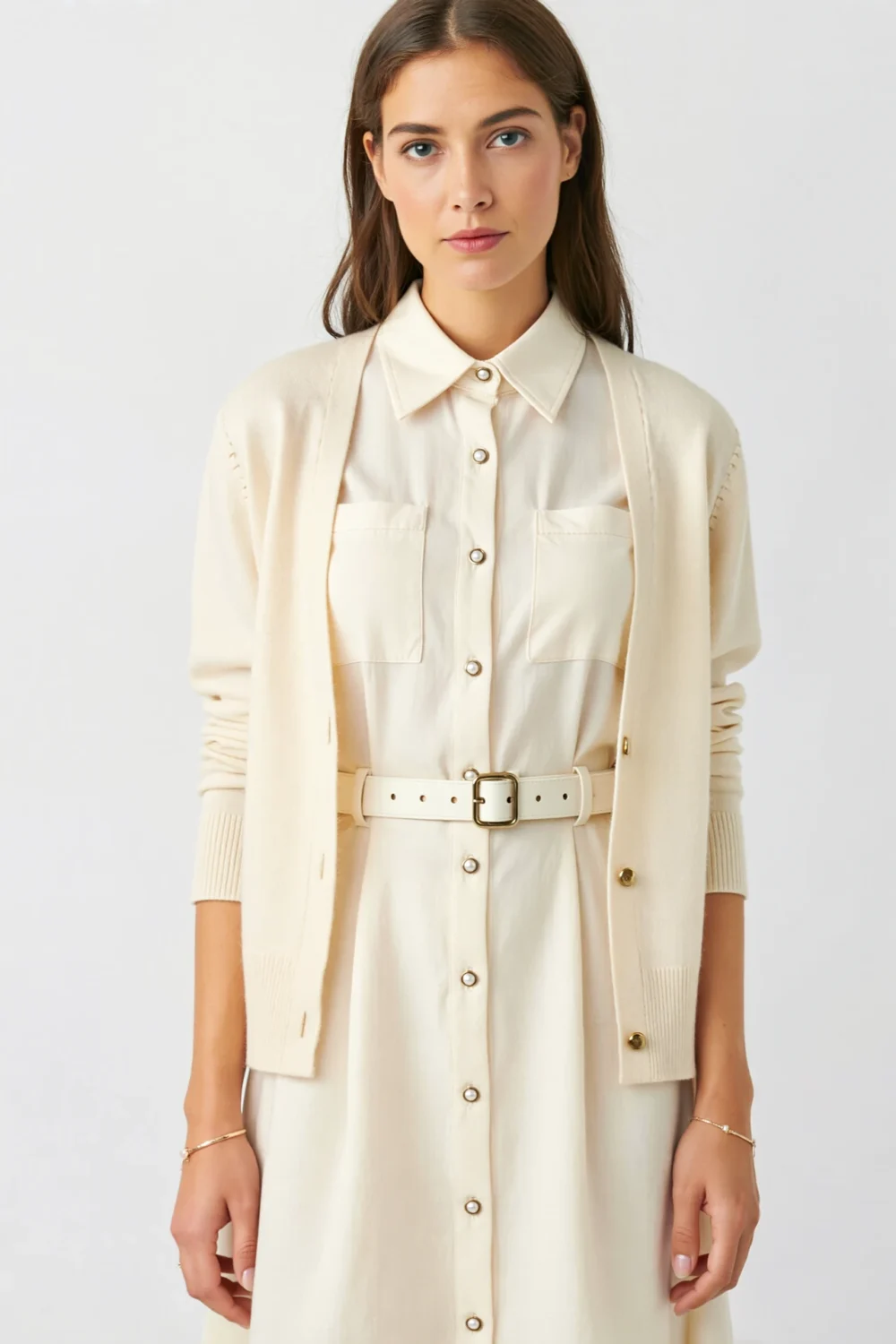 Cream belted shirt dress with button front and cardigan, creating a neat, versatile christening outfit with polished daytime style