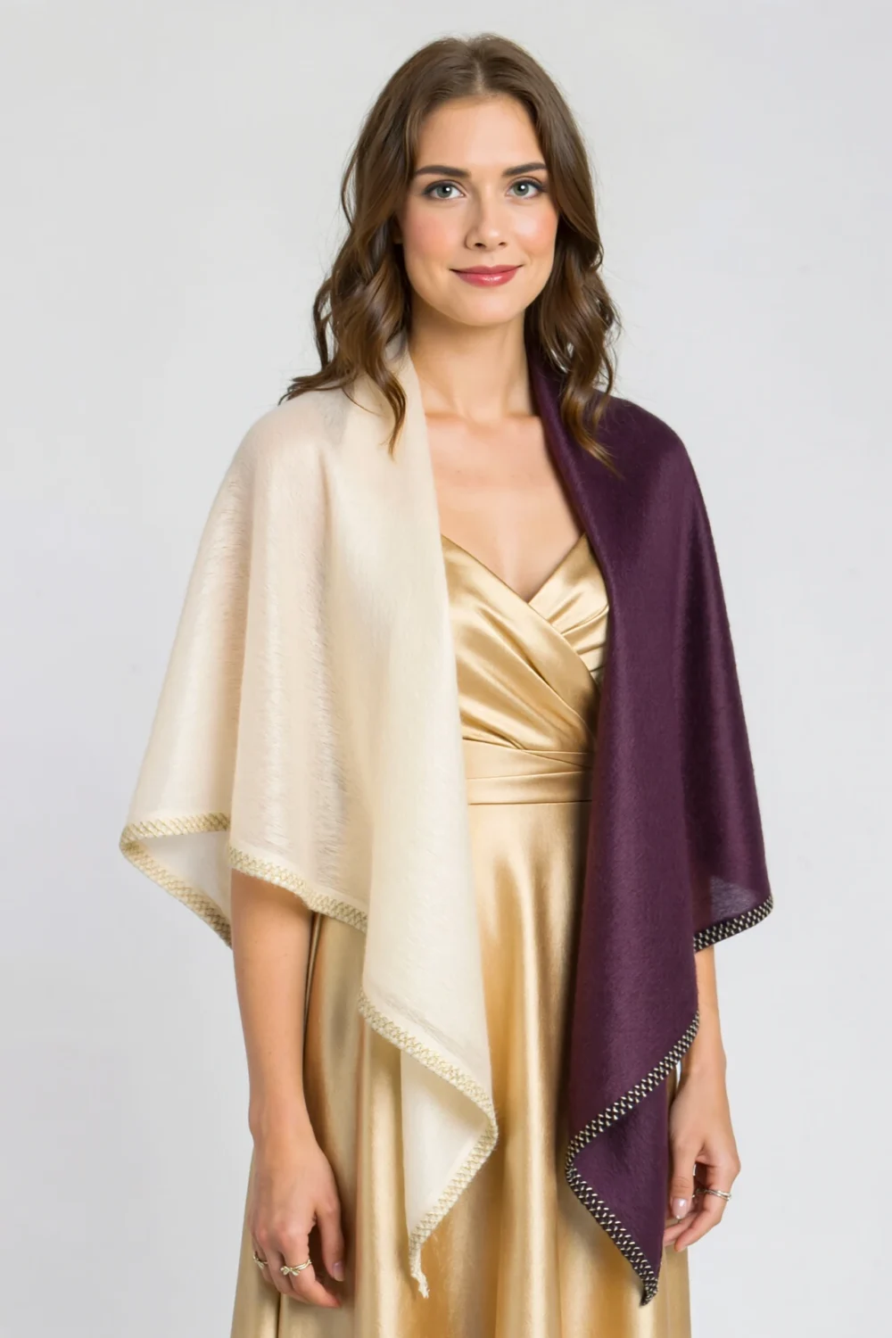 Woman in a gold wedding dress wearing a silk chiffon shawl and soft pashmina wrap in ivory and plum, elegant layered look