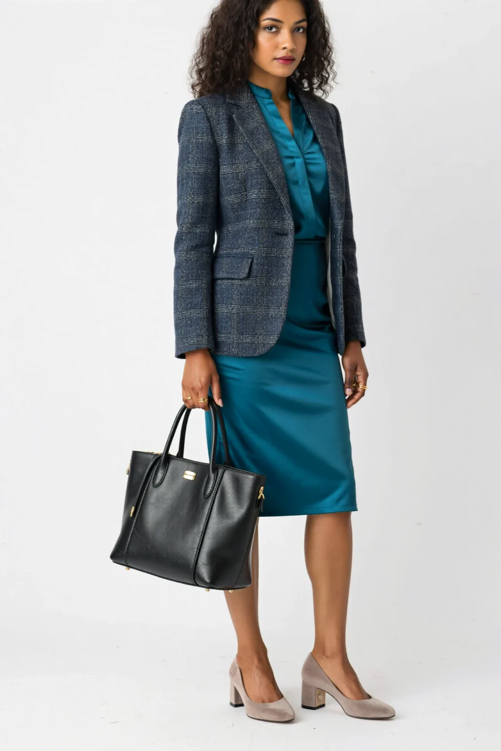 Teal dress with taupe mid-heel pumps, structured blazer, and black leather tote for a polished, modern office look