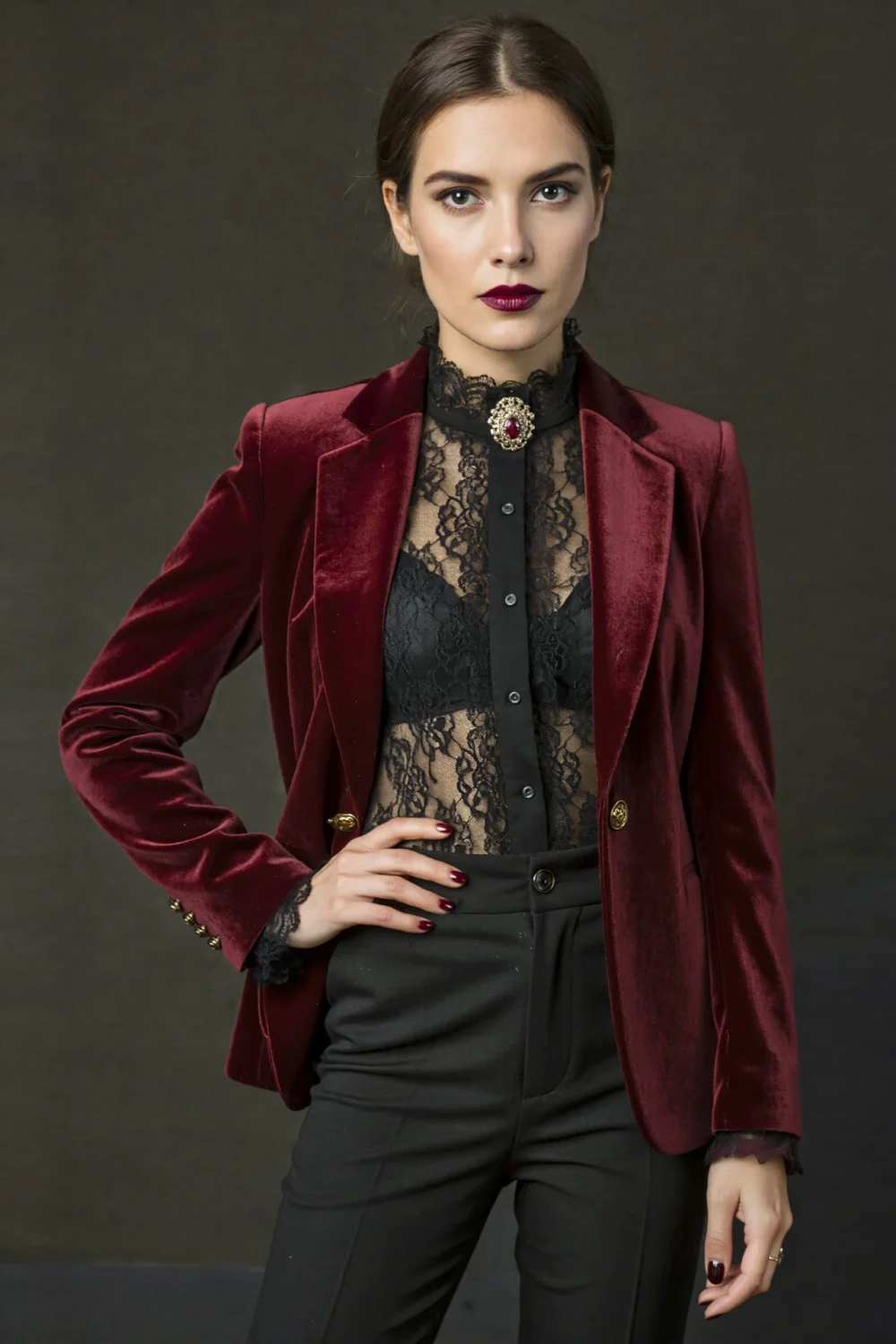 Burgundy velvet blazer over black lace blouse and cigarette trousers, creating a polished vampire-inspired tailored look with gothic glamour