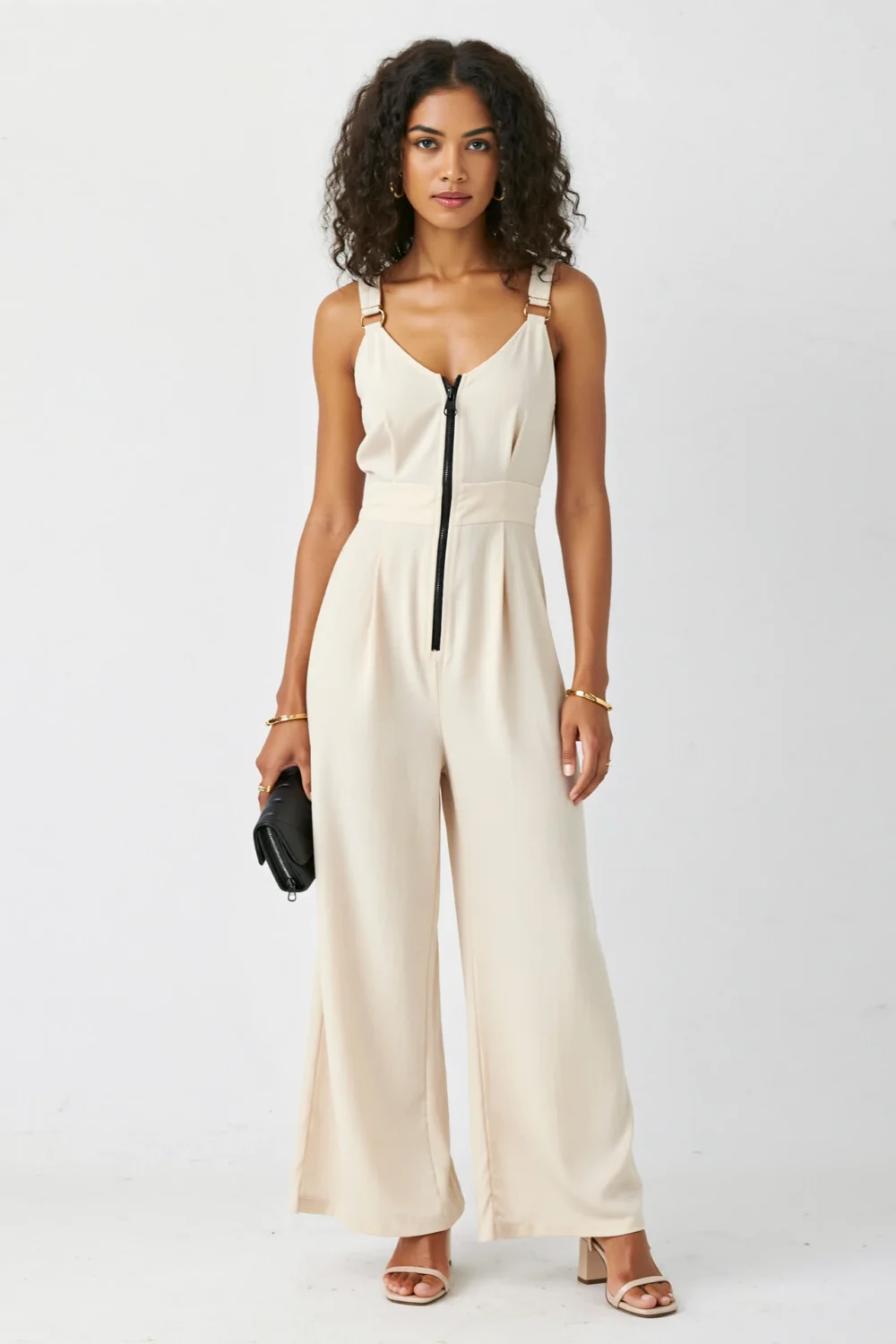 Cream wide-leg jumpsuit in matte crepe blend with defined waist, zip front, and long flowing lines for a sleek dressy look